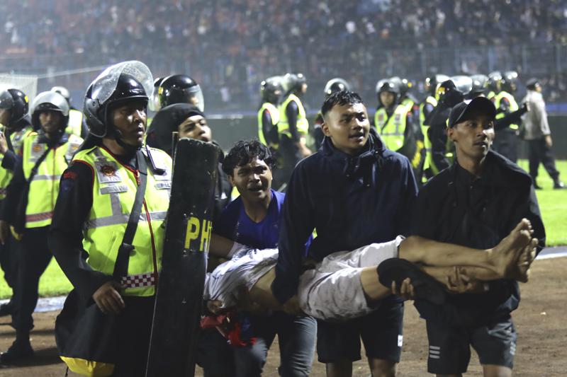 125 die as tear gas triggers crush at Indonesia soccer match