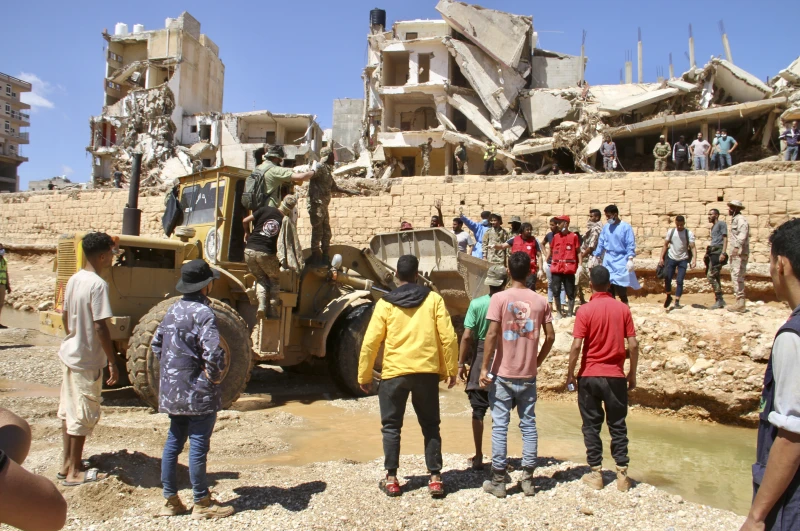 Libyan city buries thousands in mass graves after flood, while mayor says death toll could triple