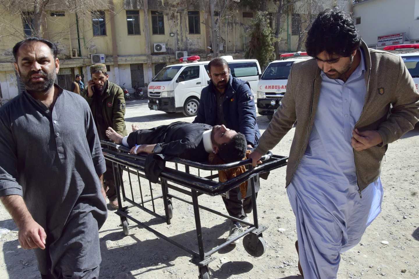 Twin bombings at Pakistan political offices kill at least 26 a day before voting begins